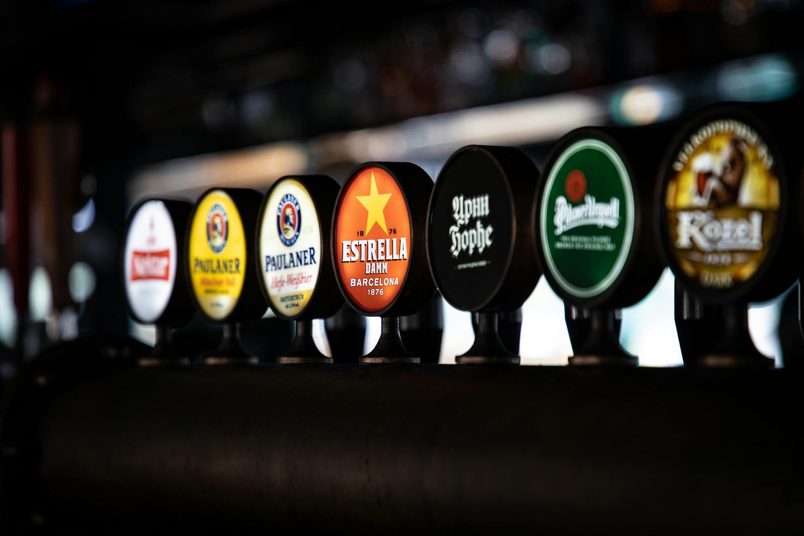 Row of beer taps on a kegerator — an office tap setup