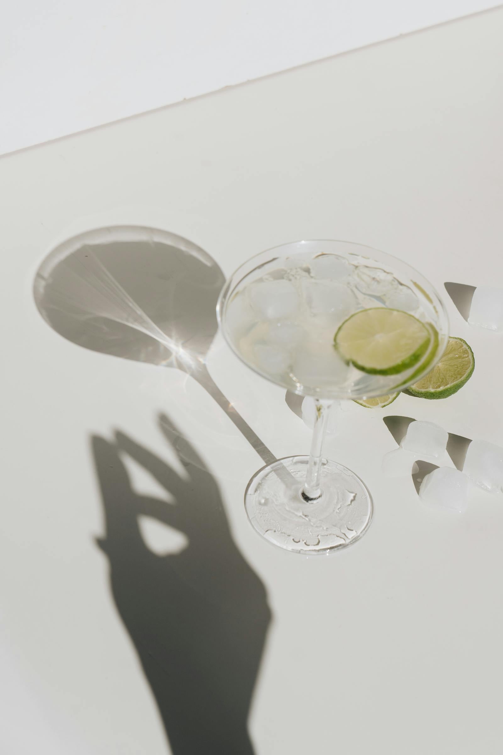 Cocktails and a beer lined up on a bar for a party