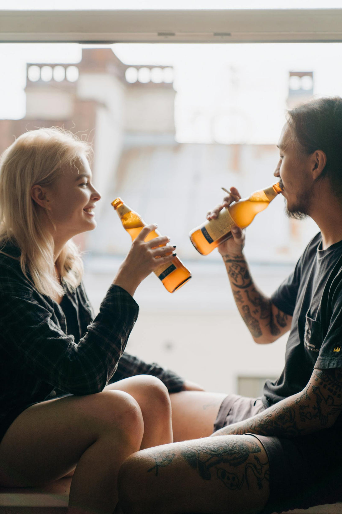 Friends gathered with beers at a large office party