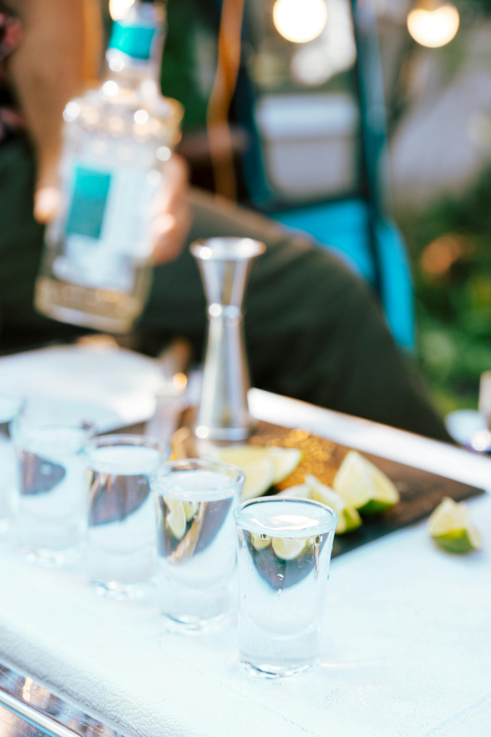 Tequila bottles and agave — blanco, reposado, and añejo lineup